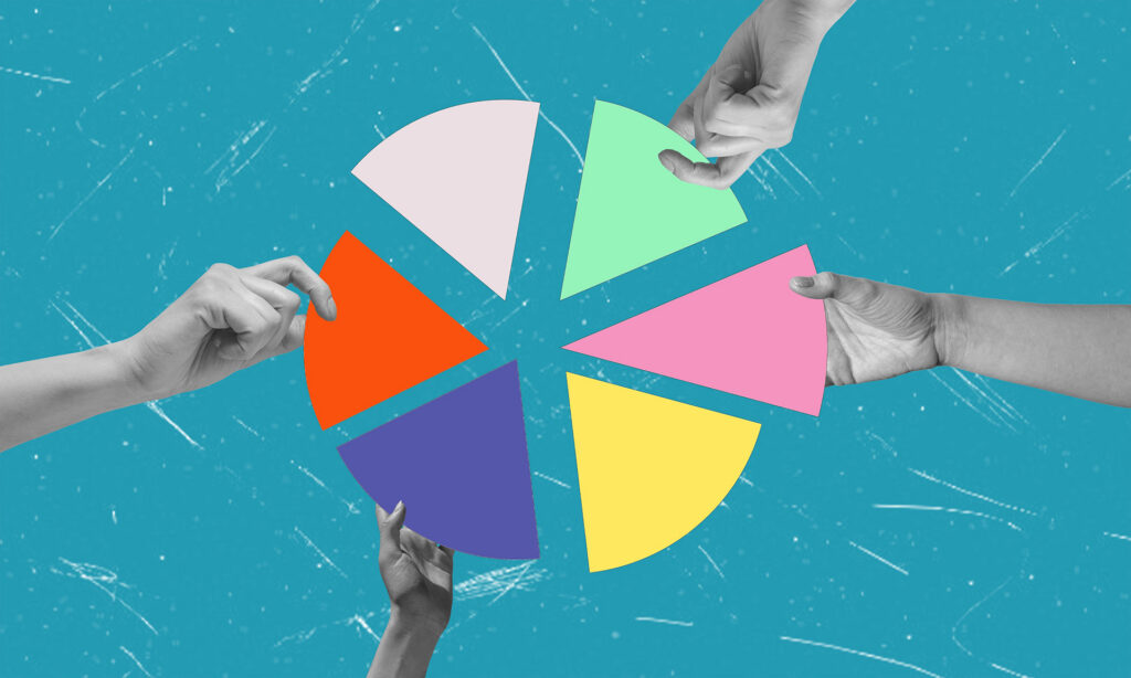 Hands assembling colourful sections of a pie chart